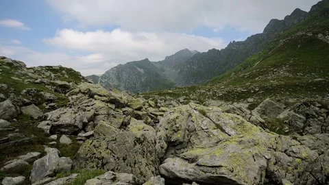 Dynamic white clouds over Fagaras Mountains, Romania. 4k timelapse. Stock Footage 77140678