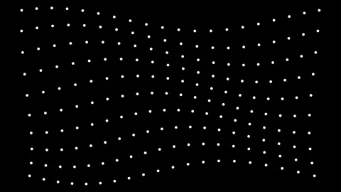 Dynamic white dots moving in a flowing wave pattern across a dark black bac.. Stock Footage 345548048