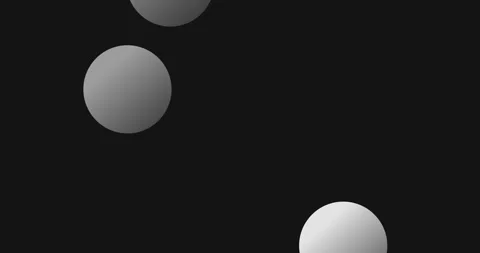 Dynamic white spheres bouncing across dark surface, generating kinetic visual Stock Footage 317516110