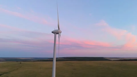 Dynamic wind turbine at colorful sunset sky Stock Footage 328438707