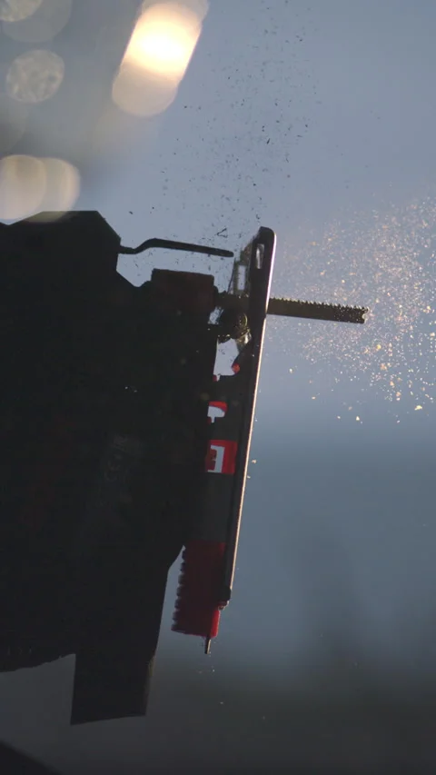 Dynamic Woodworking: 4K Vertical Slow Motion video of Jigsaw Start Stock Footage 269510209