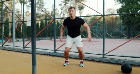 Dynamic Workout Routine Engage in Squats and Jumps for Fitness Enthusiasts and Video stock 317837965