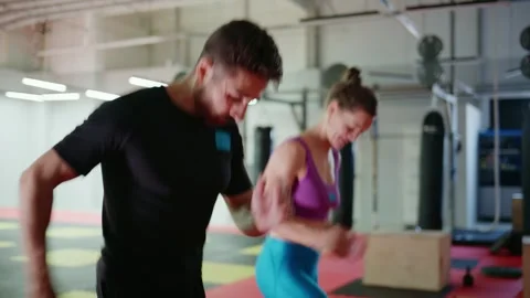 Dynamic Workout Session Featuring Pair of Fitness Enthusiasts Engaging in Stockbeeldmateriaal 329749717