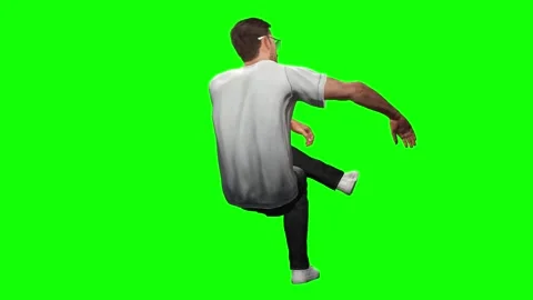 Dynamic young male performing energetic side kick isolated on green screen Stock Footage 328639684