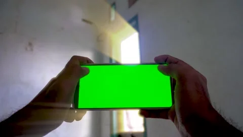 Dynamic zoom in and zoom out transition effect on a smartphone with a green.. Stock Footage 340490642