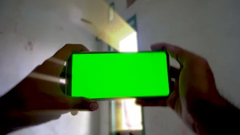 Dynamic zoom in and zoom out transition effect on a smartphone with a green.. Stock Footage 340490662