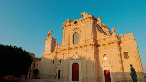 Dynamic zoom on facade of Oria Cathedral in golden light Stock Footage 315491776