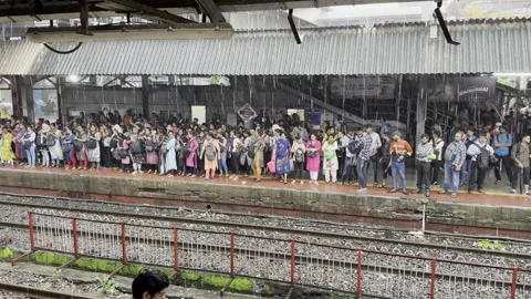 The Dynamics of a Busy Railway Platform Crowd: A Closer Look Stock Footage 253255049