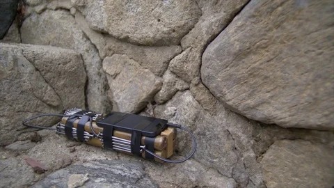 DYNAMITE AND PLASTIC EXPLOSIVES WITH CELL PHONE TRIGGER. Stock Footage 76406723