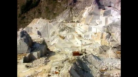 Dynamite exploding at Carrara marble mountain ranges Stock Footage