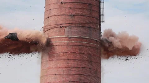 Dynamite Explosion during demolition of abandoned smoke stack. Stock Footage