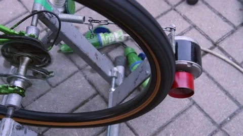 A dynamo attached to a bicycle wheel provides free electricity for free Stock-Footage 216840514