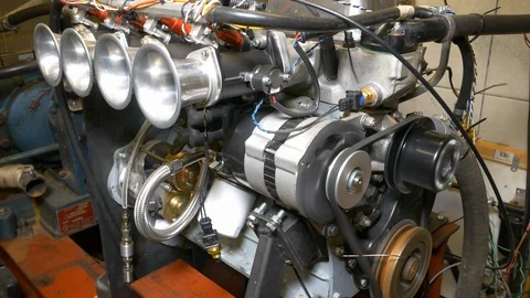 Dynamometer load testing a four cylinder engine Stock Footage 100757098