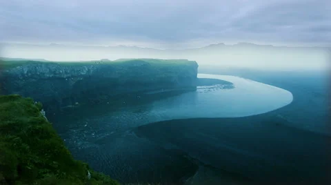 Dyrholaey, a black volcanic beach with cliffs and a river. Stock Footage 52320987