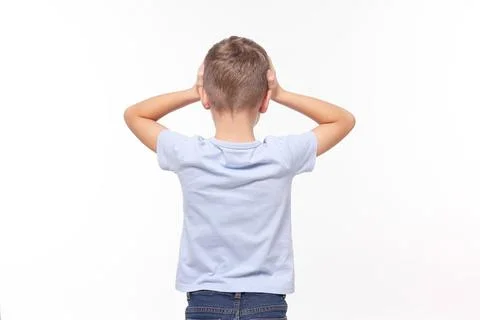Dyslexia problem. Boy covering head with hands on white background, back view 写真素材