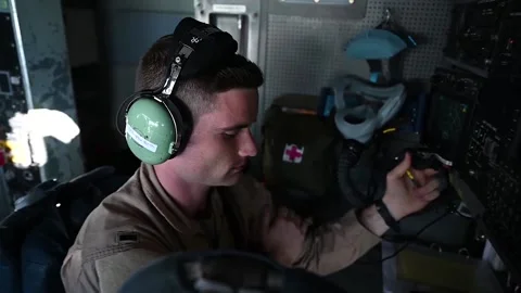 E-3 Sentry flight engineer talking into handheld radio Vidéo 151250976