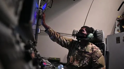 E-3 Sentry flight engineer adjusting overhead controls Stock Footage 151251050