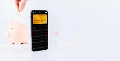 E banking concept. Mobile phone with internet online bank app. Pig bank with  Stock Photos