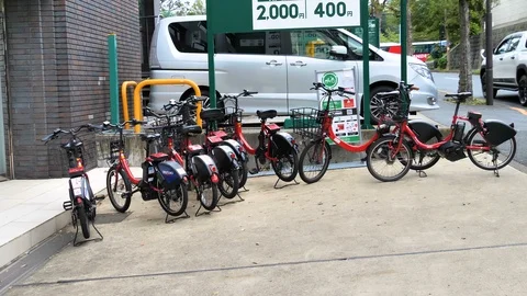 The e-bikes displayed on the side of the streets in Tokyo Japan Stock Footage 121367161