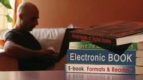 E-book, man working on a laptop 動画素材 11958876