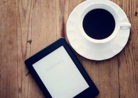 E-book reader and coffee 스톡 사진