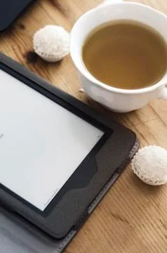E-book reader and tea Stock Photos