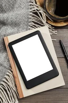 E-book reader with notebook and coffee on wooden table, flat lay. Space for.. Stock Photos