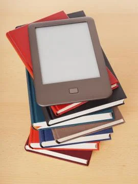 E-book reader on pile of books Stock Photos