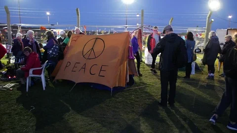 E Camera moves around Re-enactment of Greenham Common Peace Camp in the UK 4K Stock Footage 116371255