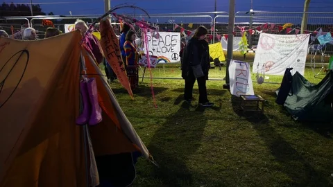 E Camera moves towards peace and love sign Re-enactment at Greenham Common Pe Stock Footage 116378731