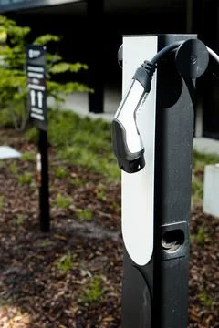 E-charching station in front of an office building Electrical car charging Stock Photos