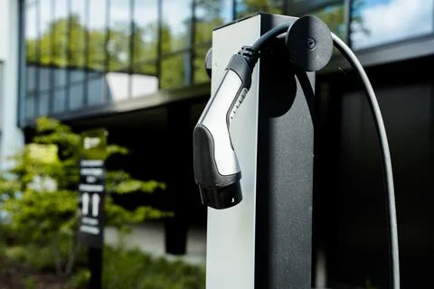 E-charching station in front of an office building Electrical car charging Stock Photos