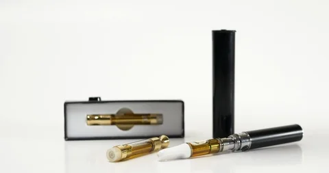 E-cigarette and vaping pen displayed on a seamless, white background. Stock Footage 120425296