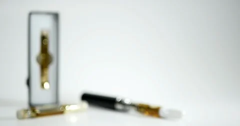E-cigarette and vaping pen displayed on a seamless, white background. Stock Footage 120426027