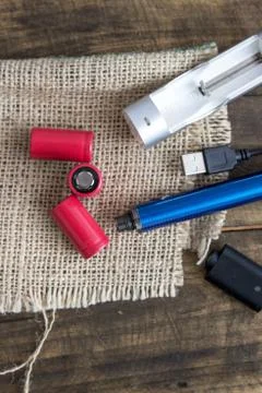 E-cigarette equipmen on table Stock Photos