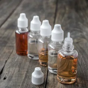 E-cigarettes,  different re-fill bottles Stock Photos