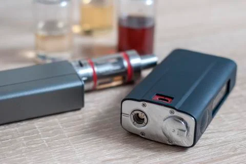 E-cigarettes with lots of different re-fill bottles Stock Photos