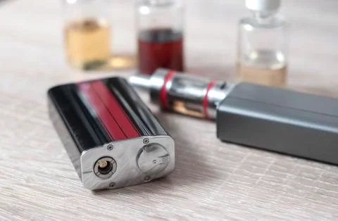 E-cigarettes with lots of different re-fill bottles Stock Photos