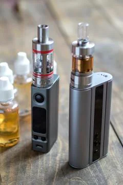 E-cigarettes with lots of different re-fill bottles Stock Photos
