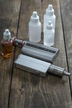 E-cigarettes with lots of different re-fill bottles Stock Photos