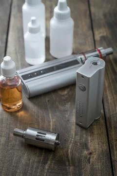 E-cigarettes with lots of different re-fill bottles Stock Photos