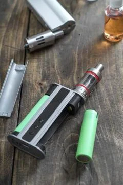E-cigarettes with lots of different re-fill bottles Stock Photos