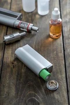 E-cigarettes with lots of different re-fill bottles Stock Photos