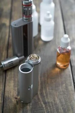 E-cigarettes with lots of different re-fill bottles Stock Photos