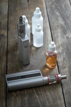 E-cigarettes with lots of different re-fill bottles Stock Photos