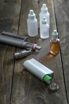 E-cigarettes with lots of different re-fill bottles Stock Photos