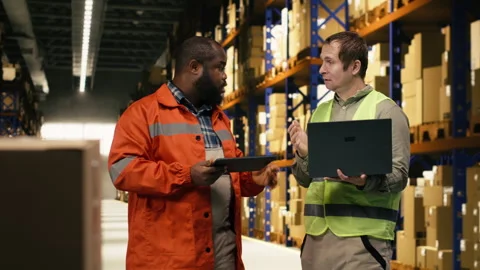 E-commerce colleagues, following packages, on tracking software, using awb tags Stock Footage 332909381