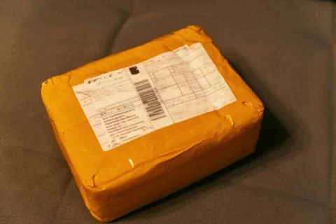 E-commerce Delivery: Small Package Received from the Marketplace Stock Photos