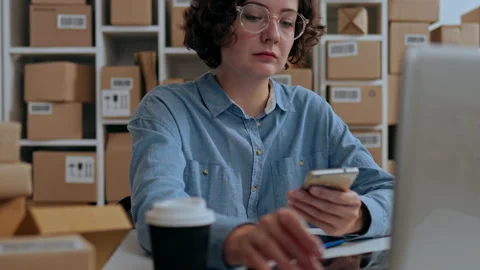 E-commerce, Product packaging worker Slowly Working on a laptop in an e-comm Video stock 233516433