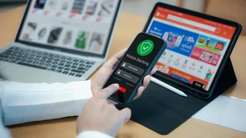 E-commerce shopping and mobile banking payment at workspace,Fintech concept.. Stock Photos